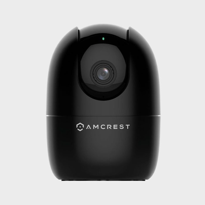 Black security camera lens focuses forward; labeled 