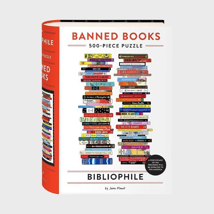 Puzzle box displays stacked colorful books labeled 