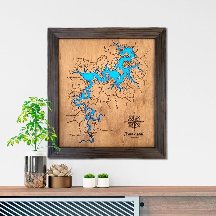 Framed wooden map showing blue waterways labeled 
