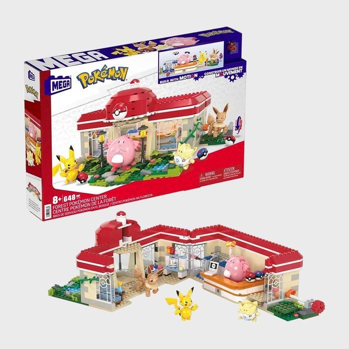 Building set box showing PokÃ©mon center with figures; characters appear playful. The set is for ages 8 and up, containing 648 pieces.