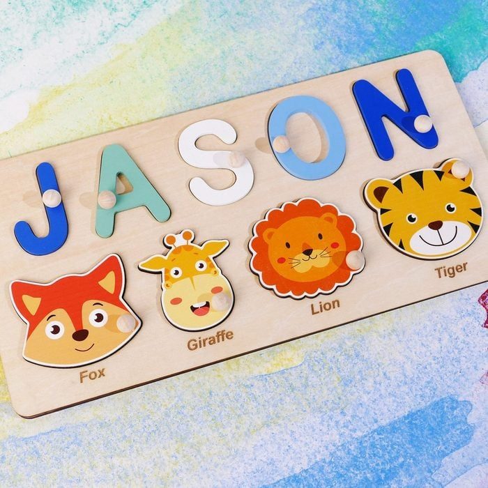 Puzzle board displays cartoon animals below colorful letters spelling 