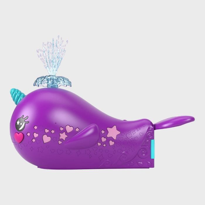 Purple toy narwhal releasing water spray, covered in hearts and stars, set against a plain gray background.