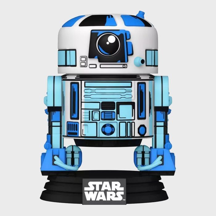 Robot figure stands on a black base, displaying blue and white color patterns. Text reads 