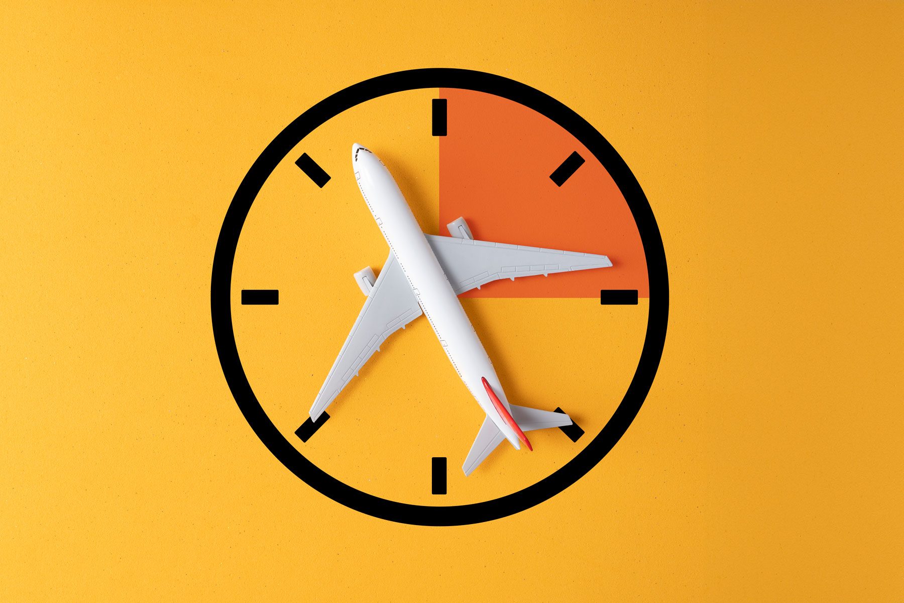 Airplane positioned diagonally across a clock face on a yellow background. The clock has a quarter orange segment, indicating time-related travel theme.