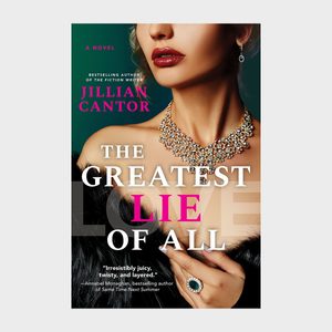 Necklace adorns woman's neck with hand holding fur; elegant book cover text reads: 