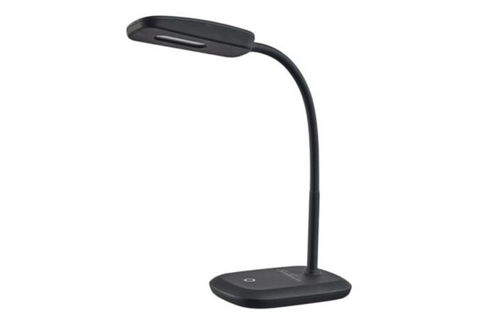 A black desk lamp with a flexible neck stands upright on a flat surface, against a plain white background.