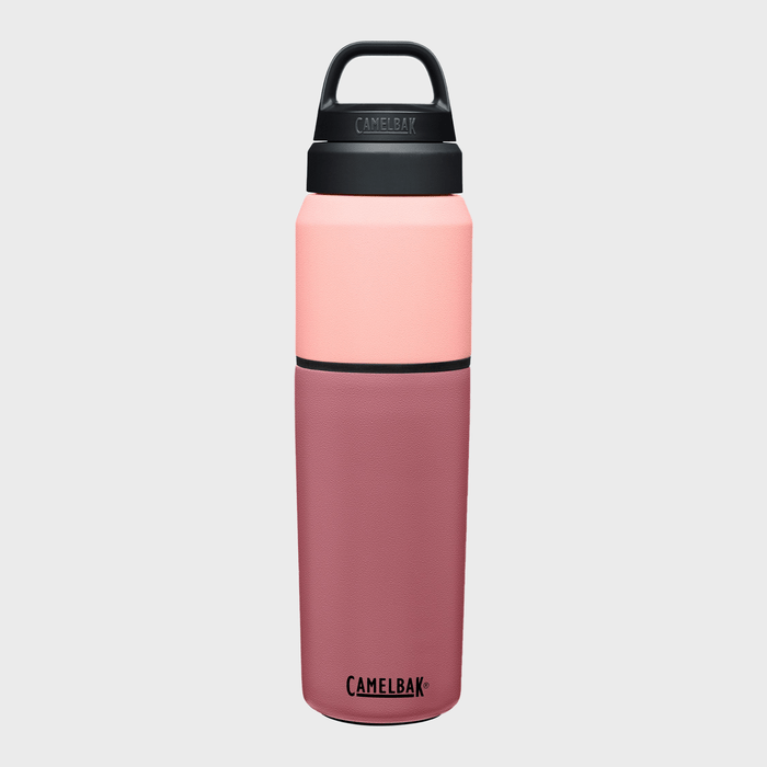 Insulated tumbler stands upright against a plain backdrop, featuring a two-tone pink design. Text reads 