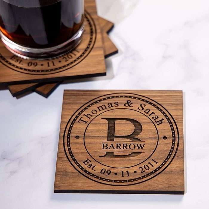 Wooden coaster displays the text 