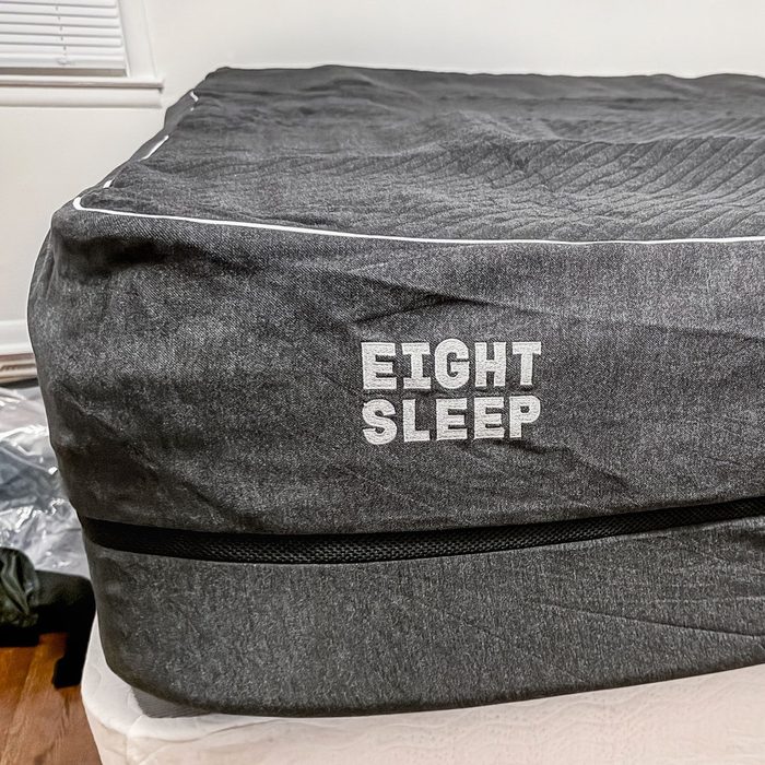 Mattress wrapped in dark fabric displays 