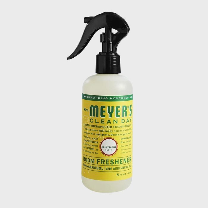 Spray bottle stands upright with a black trigger, labeled 