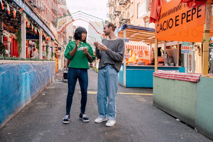 110 Romantic And Fun Date Ideas To Spark A Connection - couples enjoying in a street fair