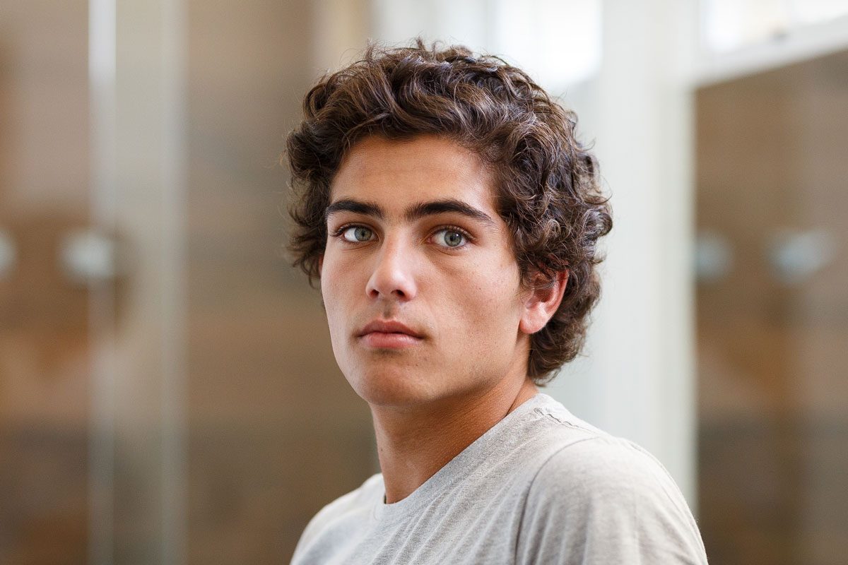 Serious Young Man With Green Eyes