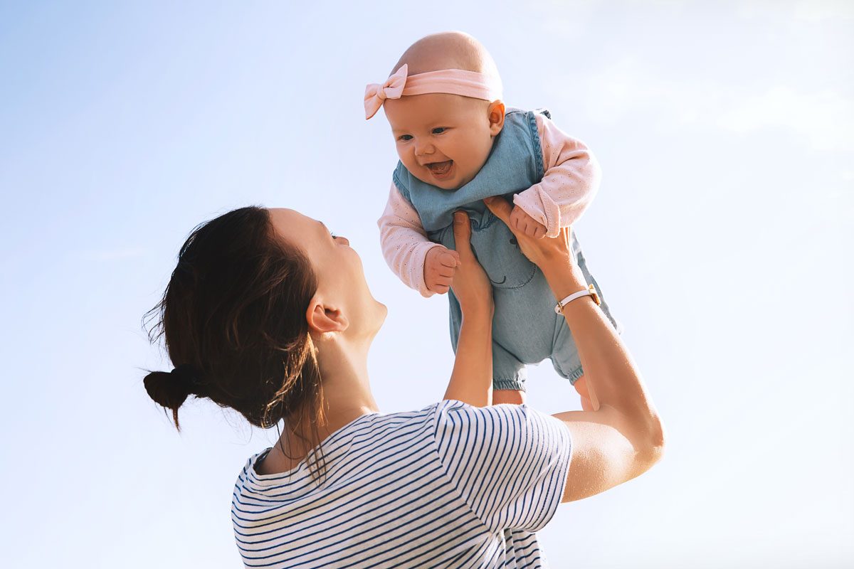 Young Mother Throws Up Baby In The Sky