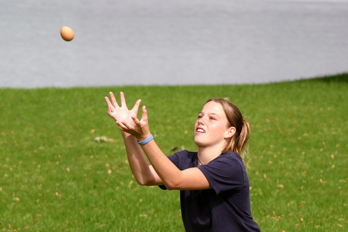 girl catching egg
