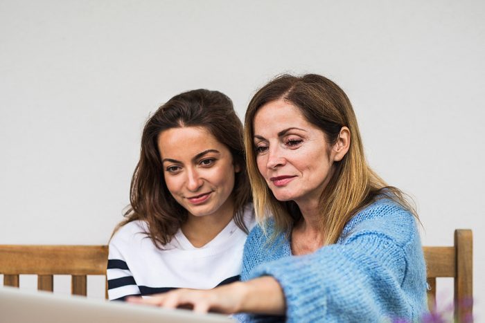 mother and daughter sitting together