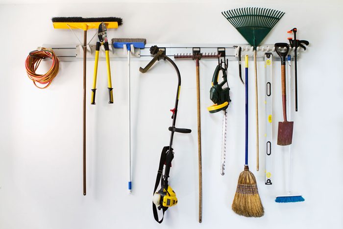 Neat garage tools hanging on a storage rack