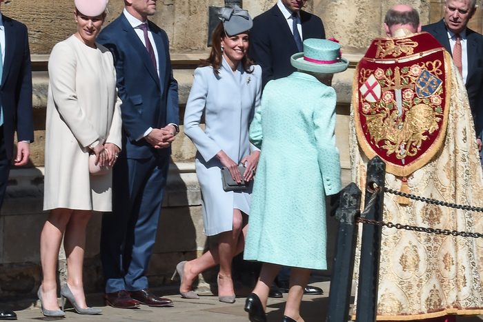 Kate Middleton demonstrates one of the hallmarks of royal etiquette, the curtsy, as she greets Queen Elizabeth outside St. George's Chapel in Windsor